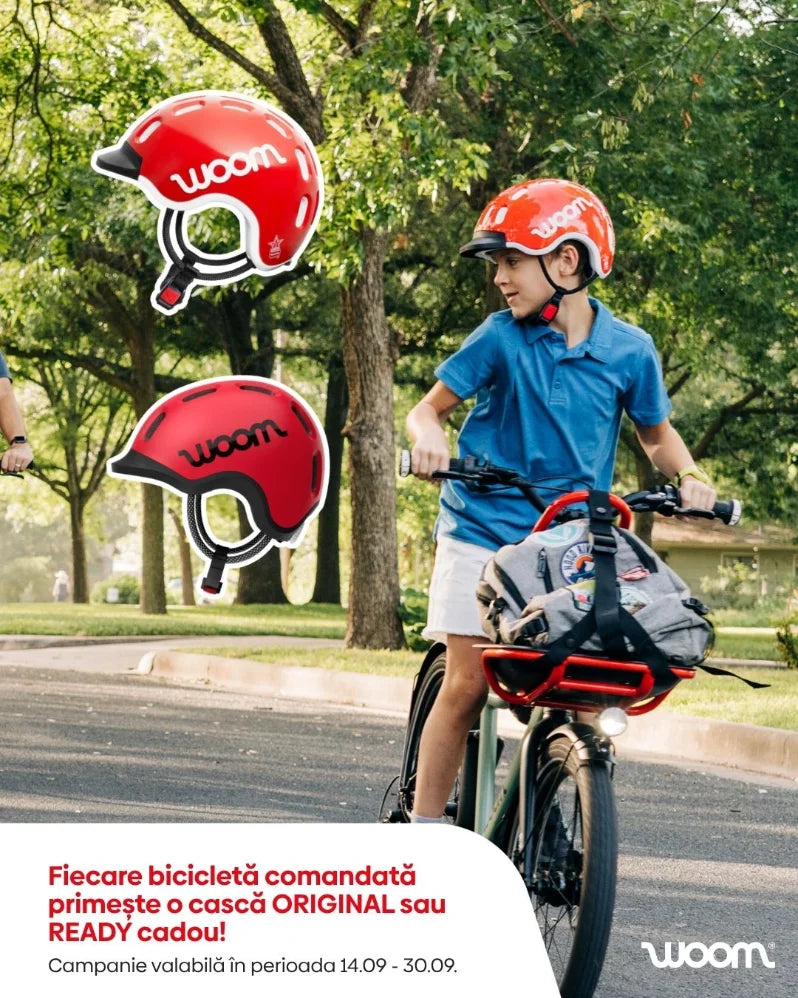 Copil pe bicicletă woom, toamnă